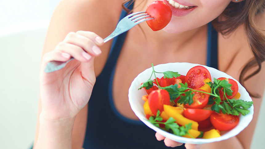 girl eating salad photo