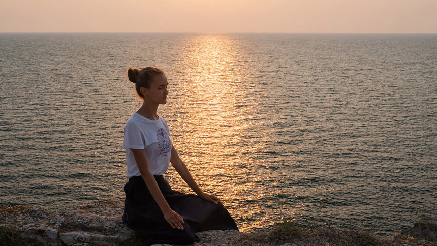 girl meditating, black sea photo