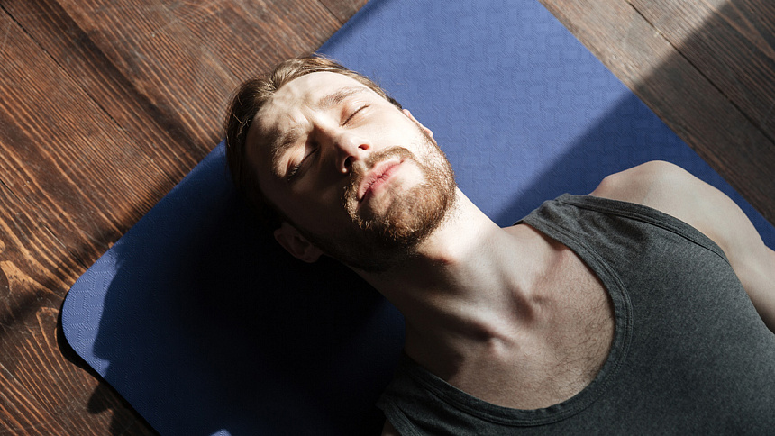 Shavasana, man lying down photo