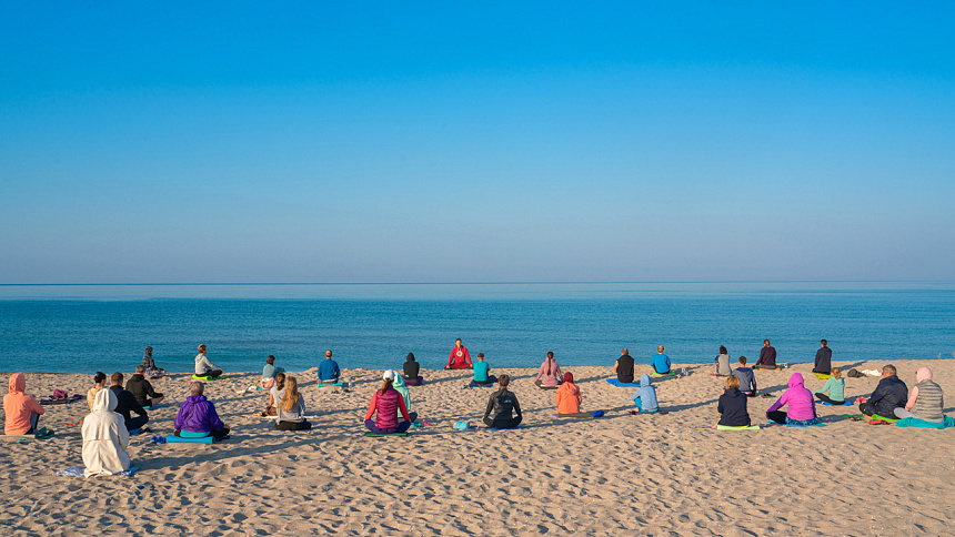 meditating by the sea, people meditating.