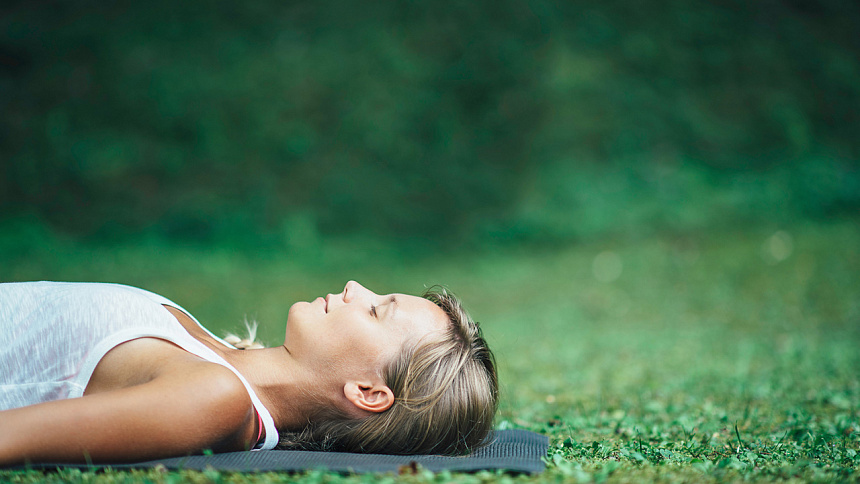 girl lying on the grass photo