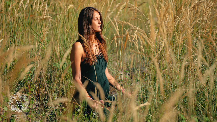 Pregnant woman meditating photo